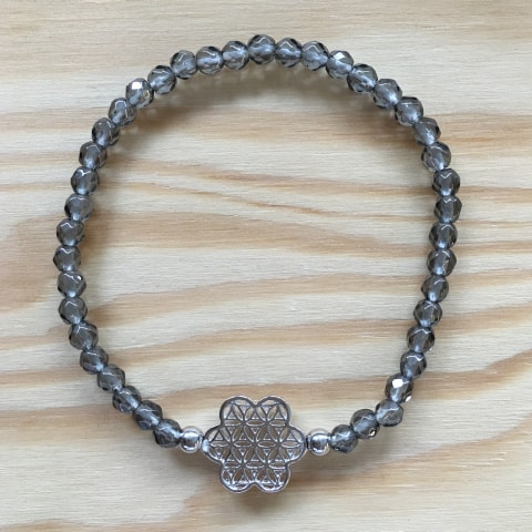 ab38-facettierter-bergkristall-bedampft-4-mm-blume-des-lebens-silber.jpg