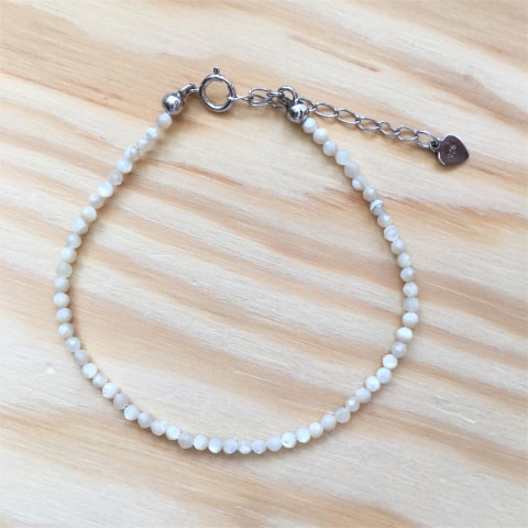 ab80-facettierter-perlmutt-beige-ca-25-mm-silber-rhodiniert.jpg