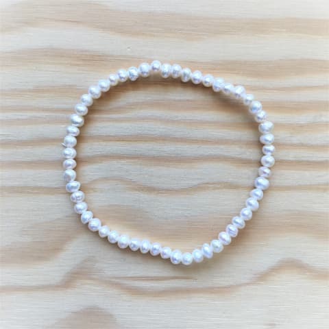 abp12-suesswasserperle-weiss-elast-armband-ca-4-mm.jpg